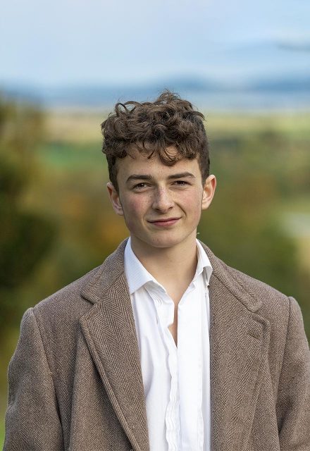 portrait of a young man with Perthshire as backdrop